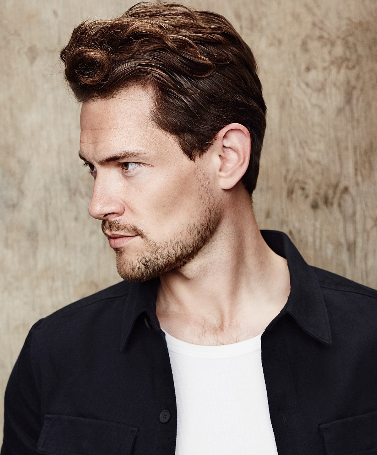 Profile of a man with styled hair.
