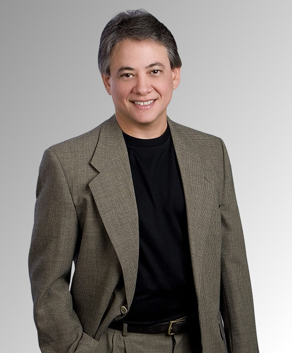 Man in business suit smiling at camera