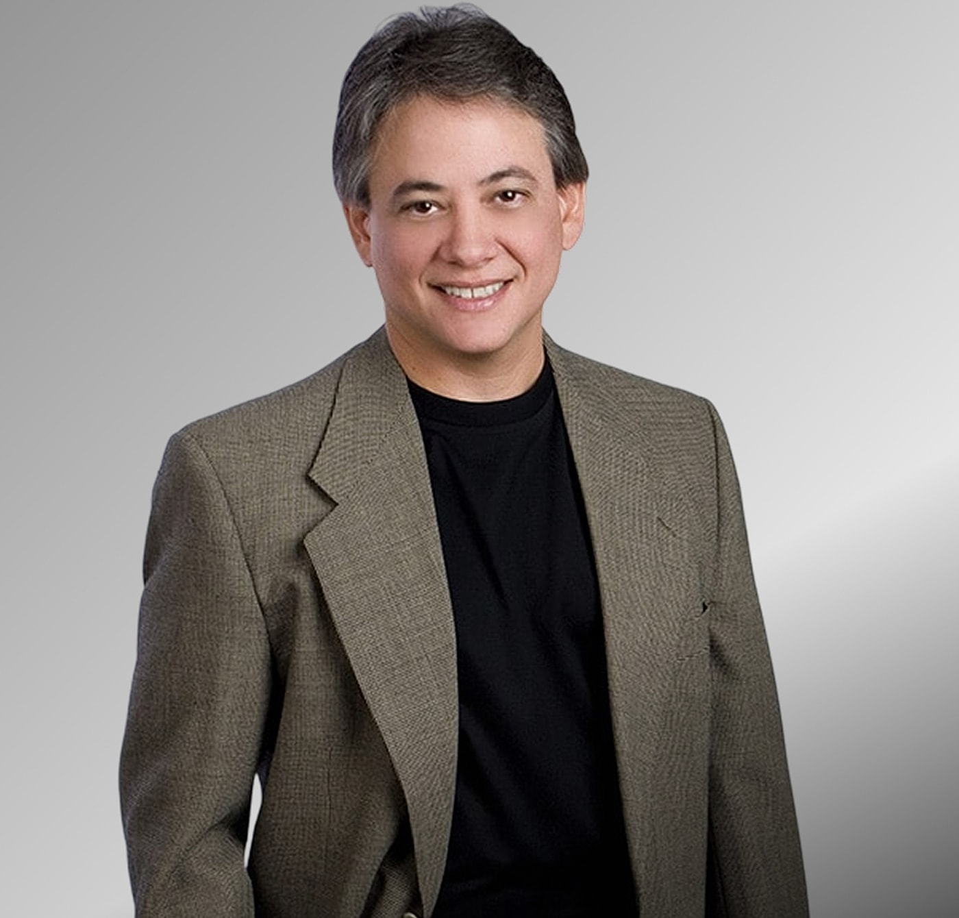 Professional man in a suit smiling confidently.