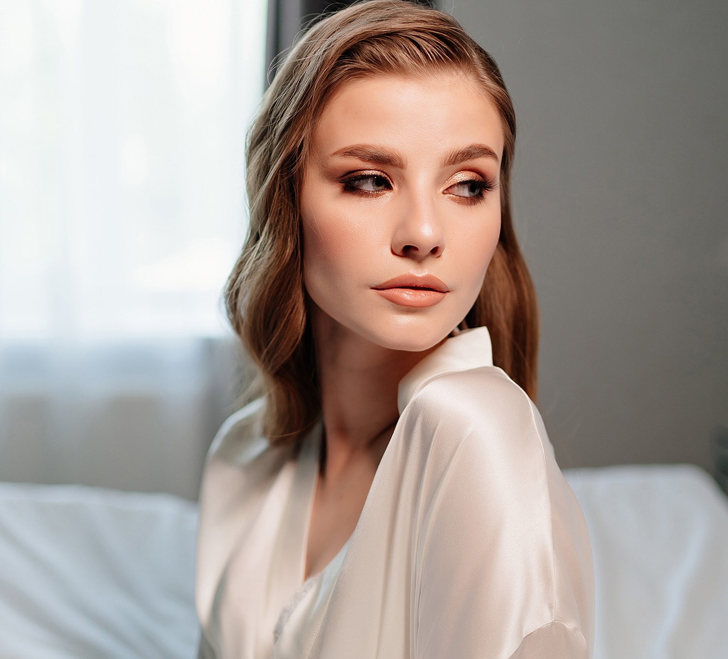 Portrait of a woman in soft, elegant lighting.