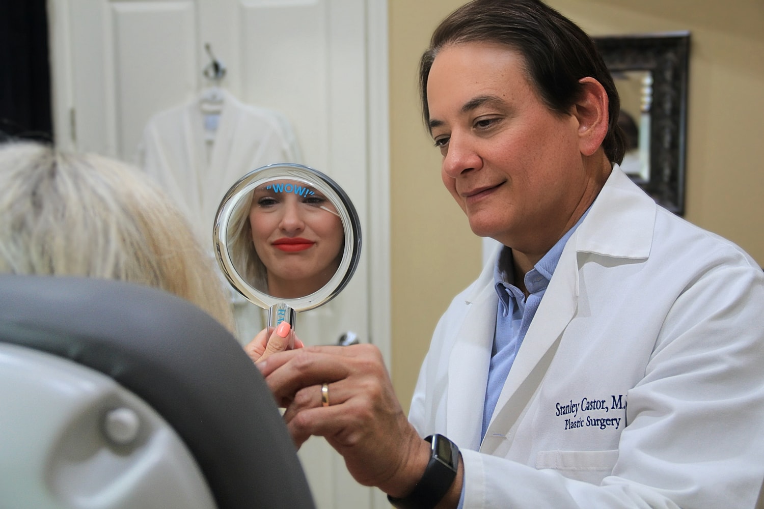 Doctor showing patient results in mirror.