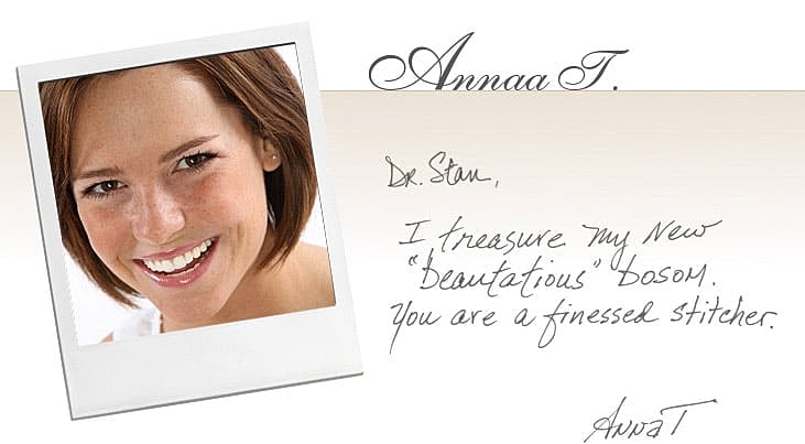 Smiling woman with handwritten note and signature.