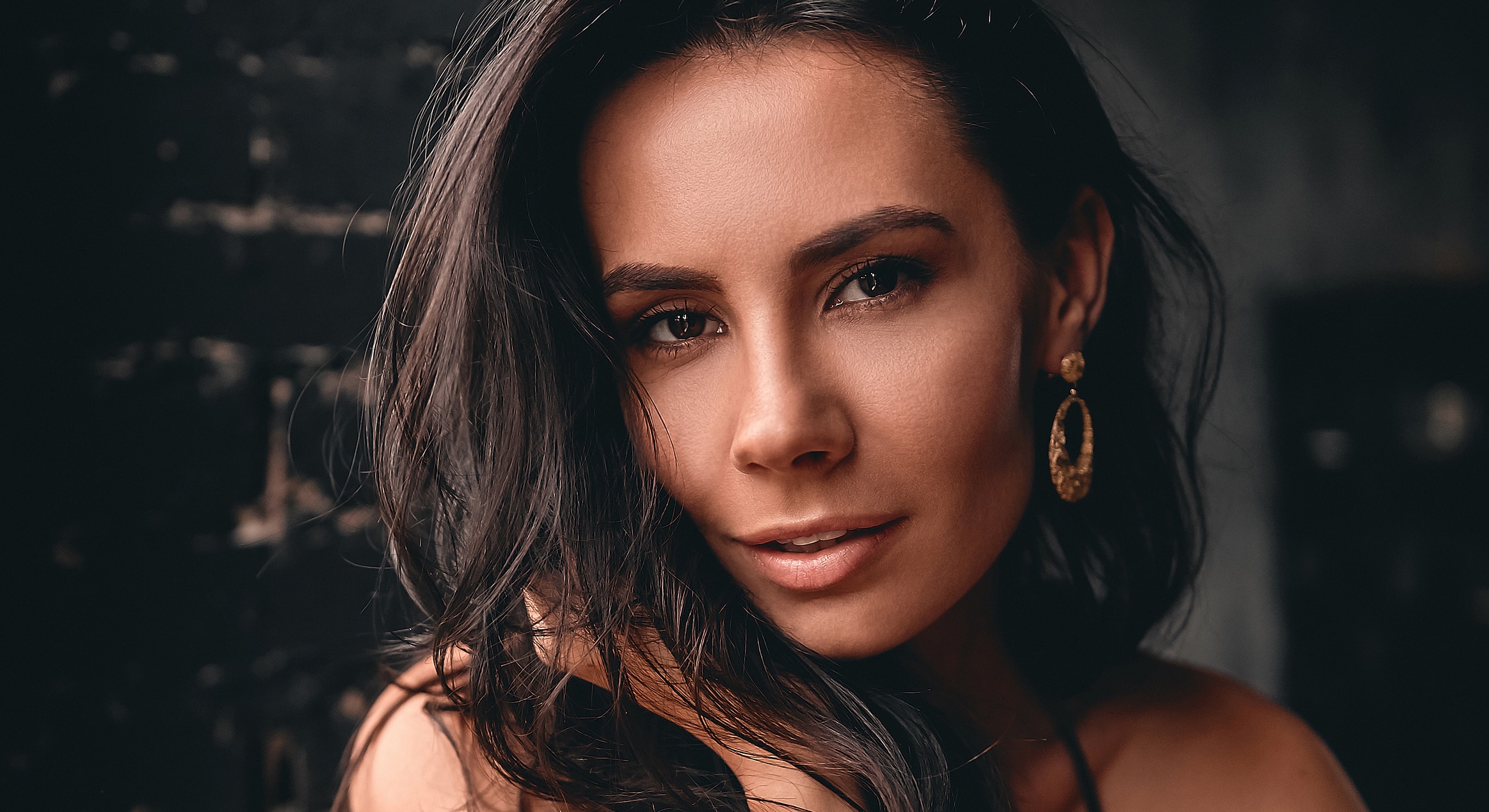 Close-up of a woman with dark hair.