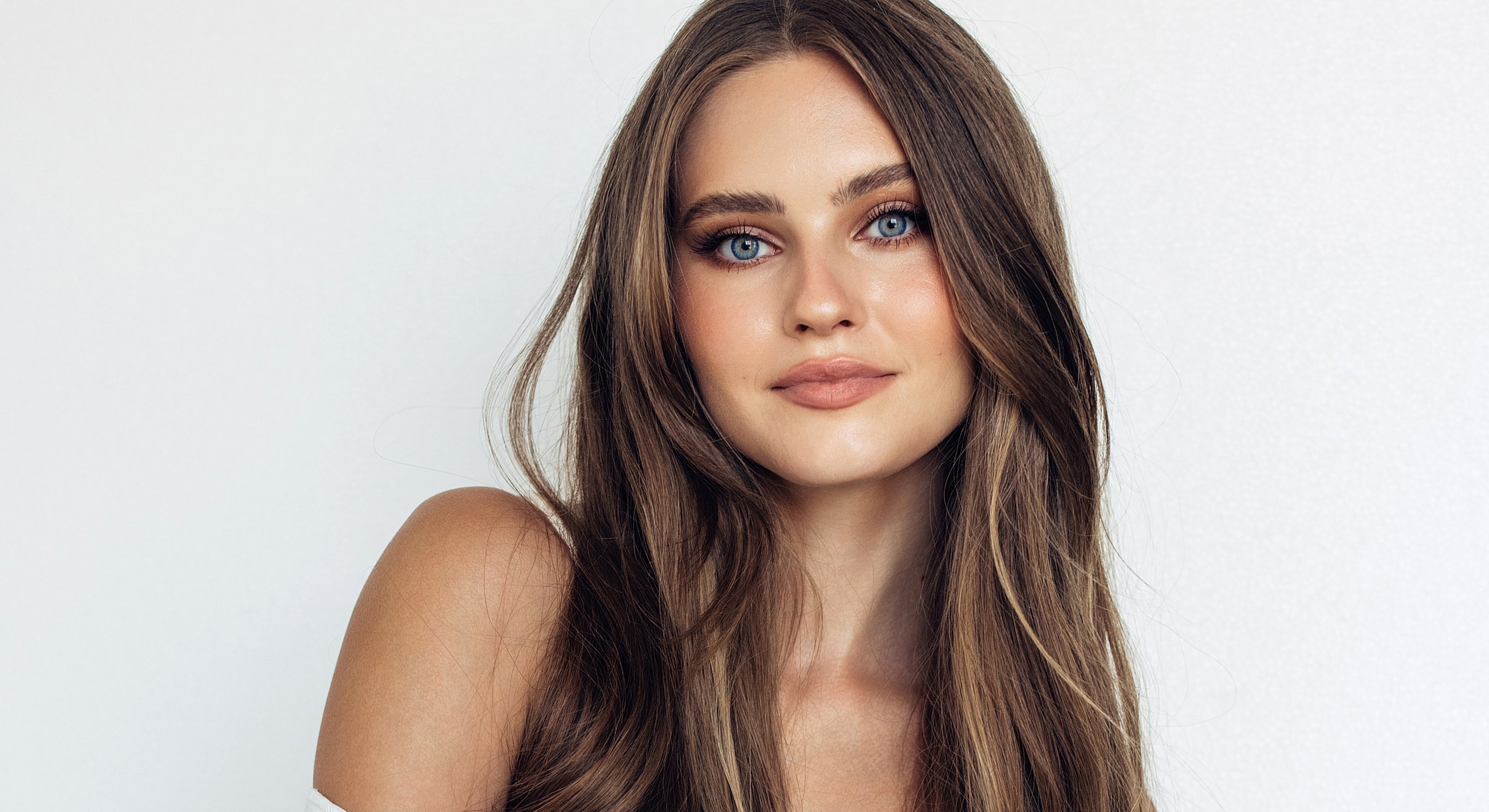 Young woman with long hair and blue eyes.