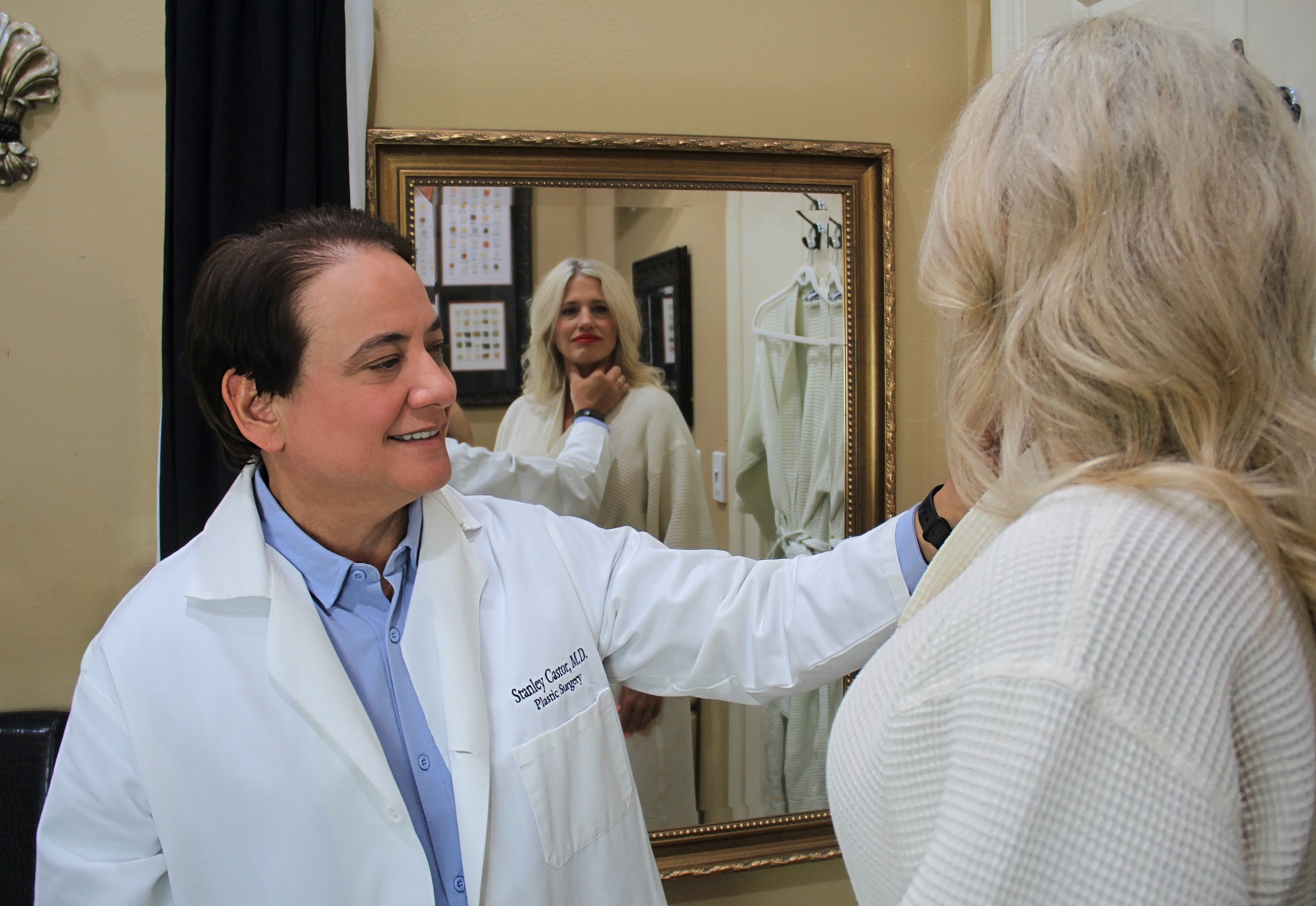 Doctor consulting with patient in mirror reflection.